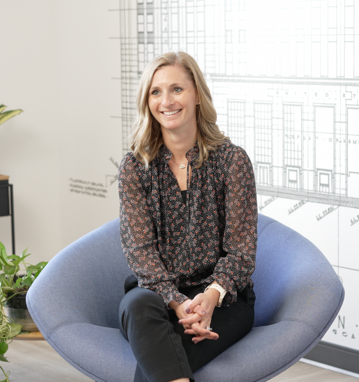 Woman sitting in a chair smiling