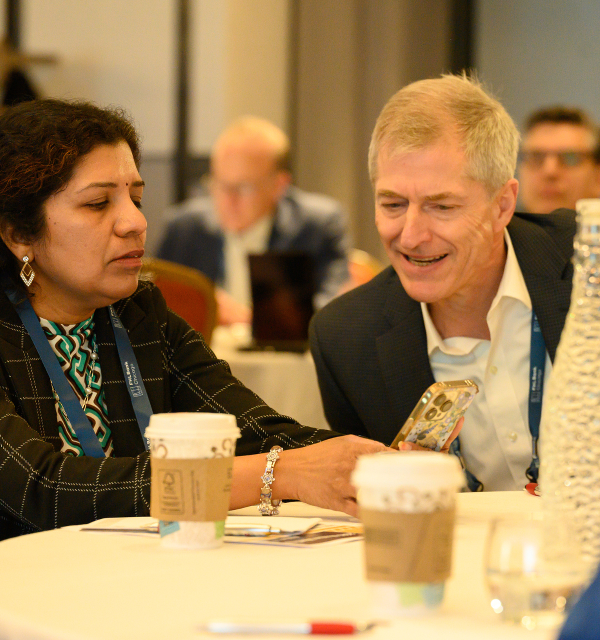 Members looking at the CVENT app together