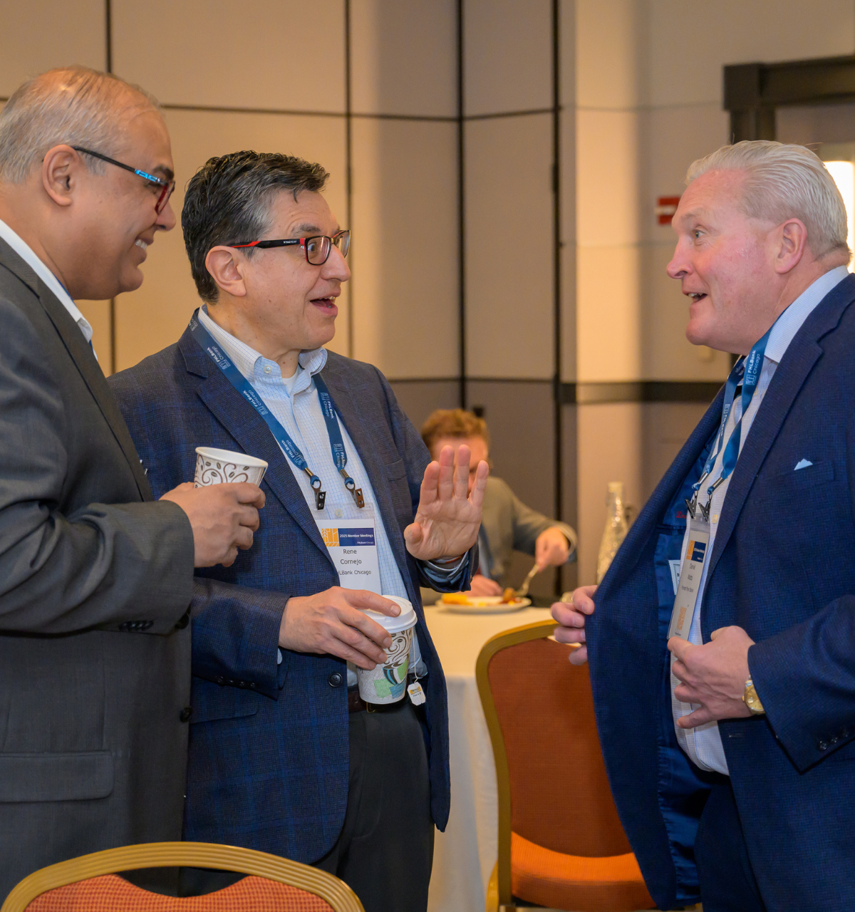 Members Conversing at 2025 Meeting