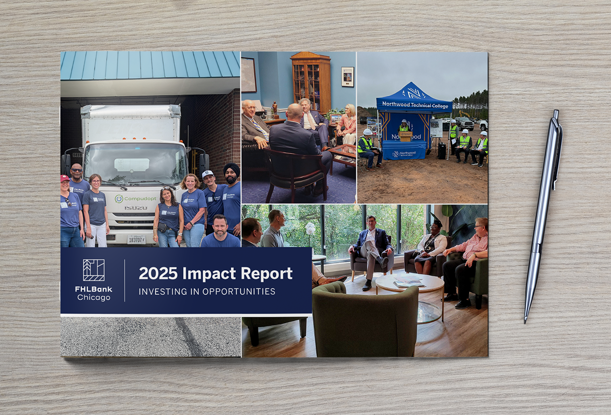 impact report cover on a gray desk