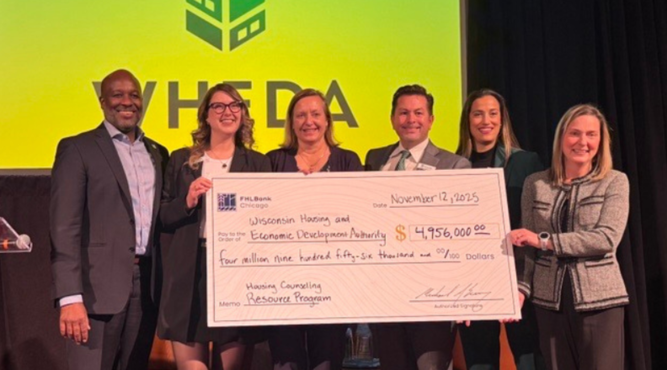 WHEDA Holding big check