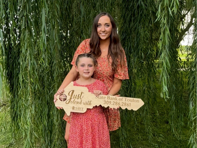 Bobbi Penn and her daughter Naomi celebrate homeownership.