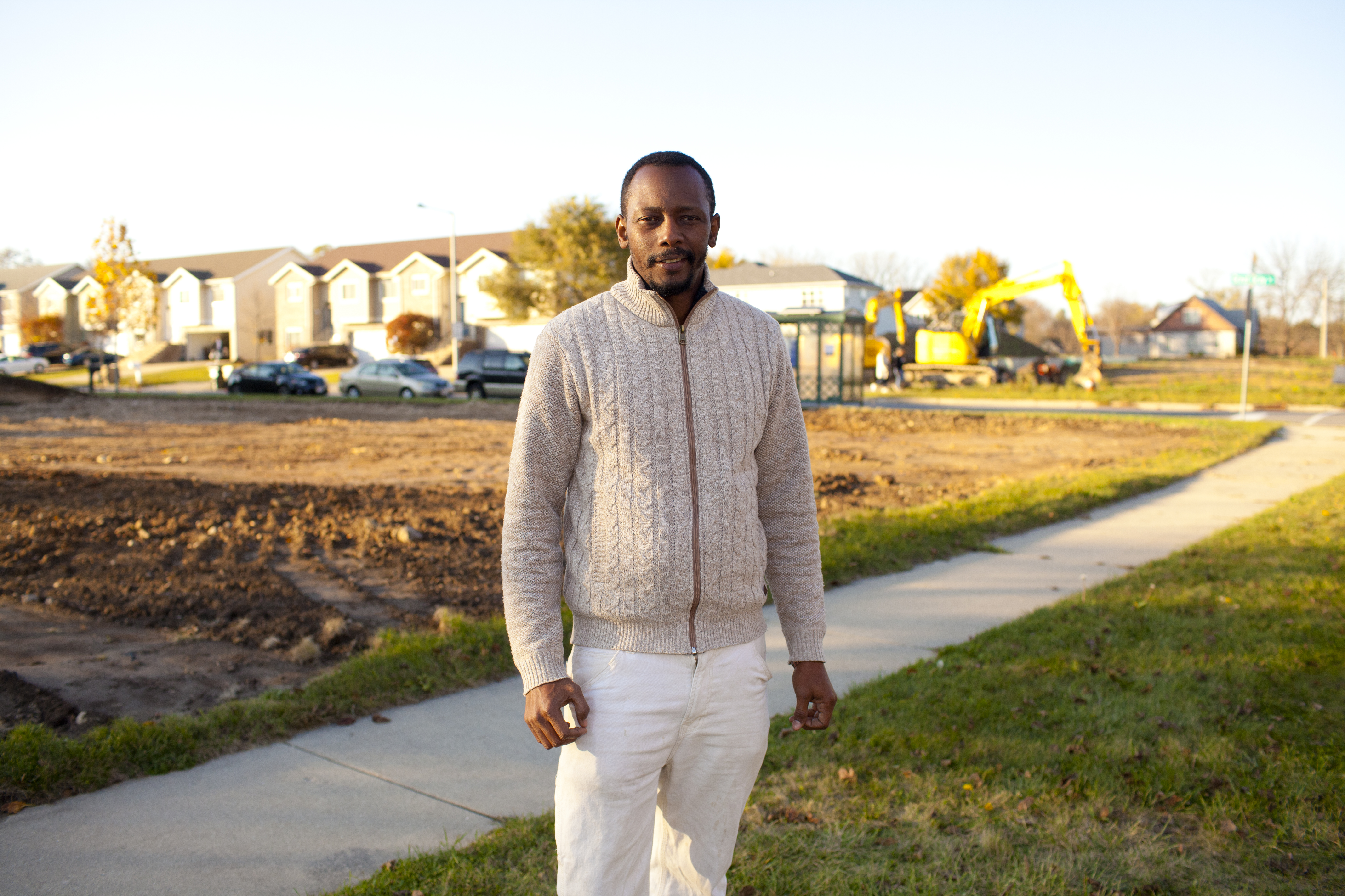 man standing outside in front of construction