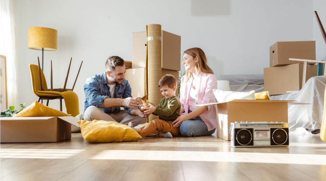 Father, Mother and Young Son move into New Home - Stock Photo